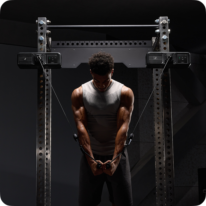 Athlete performing a cable chest fly with two Gym Nano units