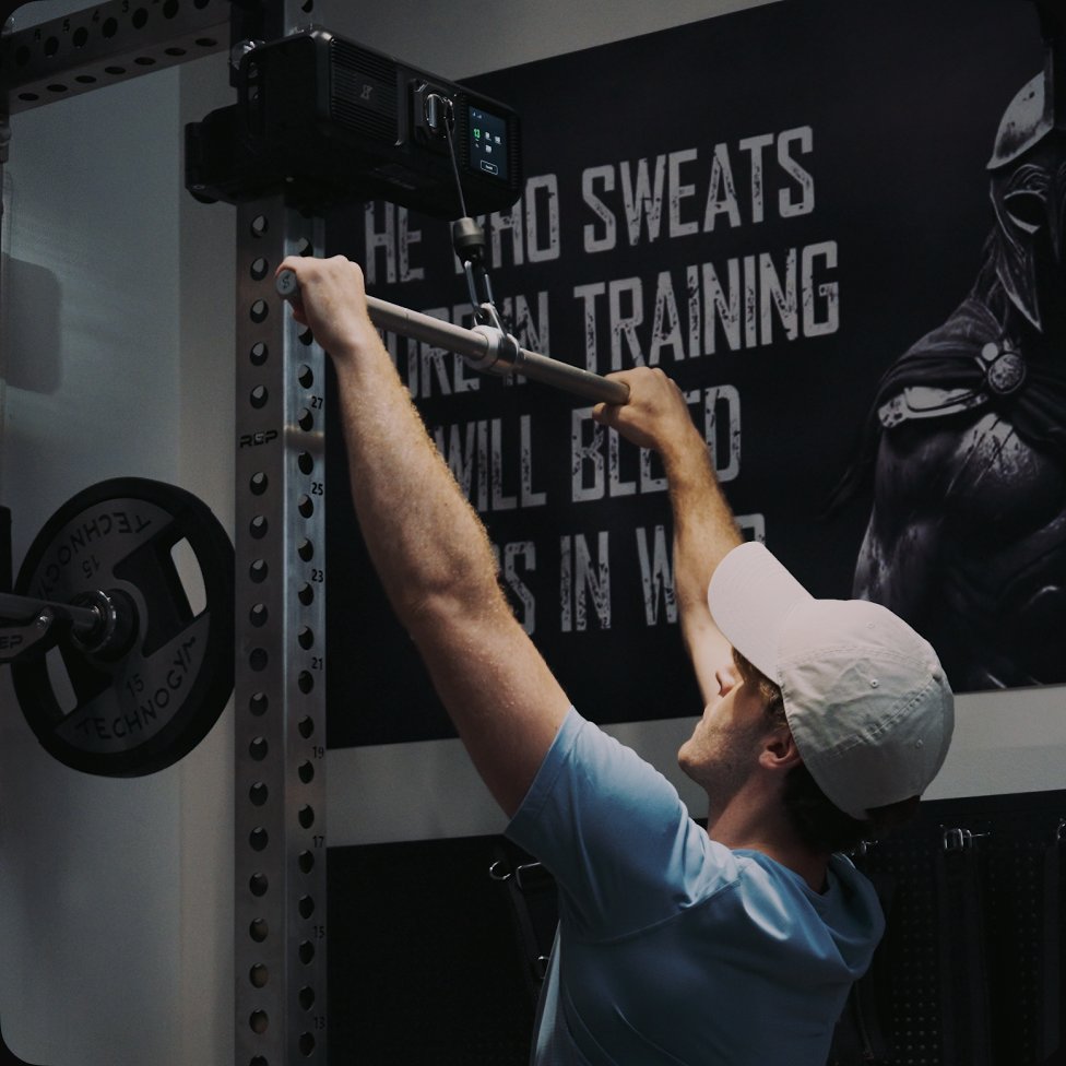 Athlete using the Gym Nano cable range